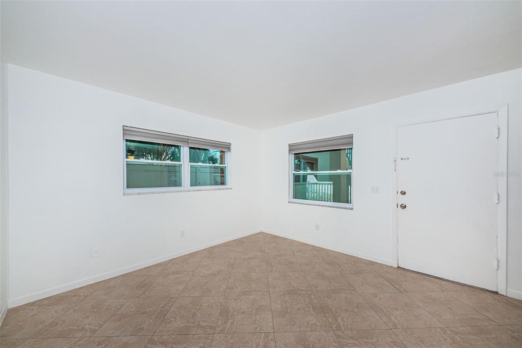 2308 1st Street, Unit 4 Indian Rocks Beach, FL 33785 - Photo 16 of 25 an empty room with windows
