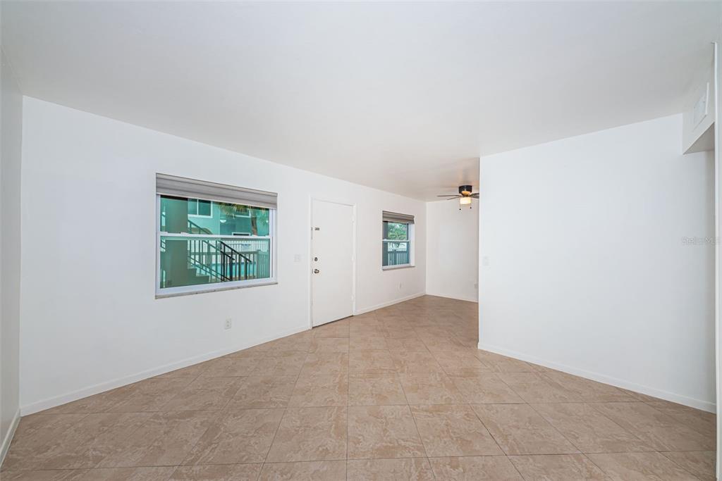 2308 1st Street, Unit 4 Indian Rocks Beach, FL 33785 - Photo 17 of 25 an empty room with windows