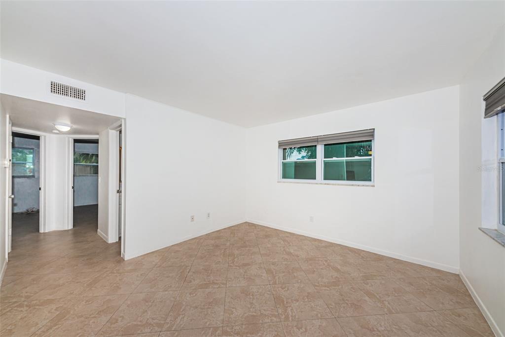2308 1st Street, Unit 4 Indian Rocks Beach, FL 33785 - Photo 19 of 25 an empty room with windows