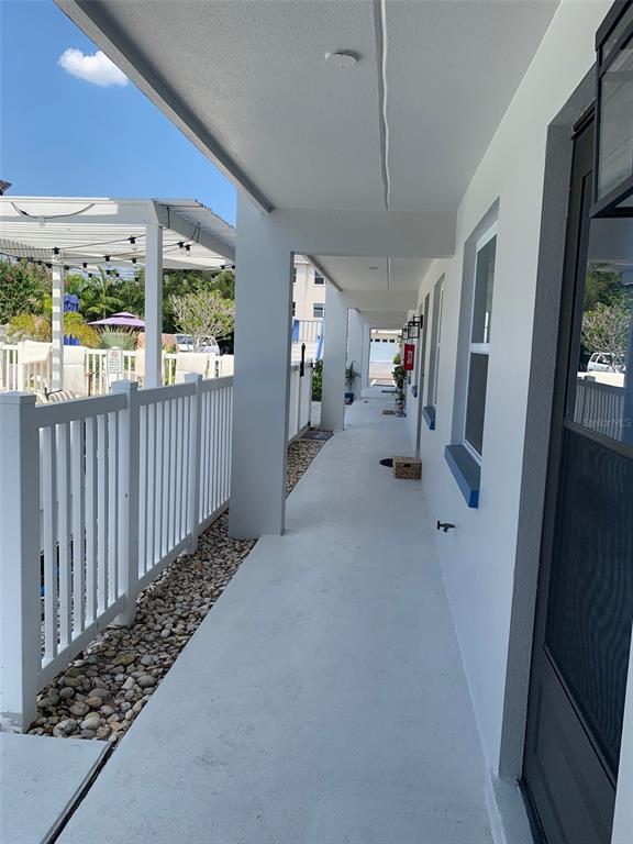 2308 1st Street, Unit 4 Indian Rocks Beach, FL 33785 - Photo 2 of 25 a view of hallway with livingroom