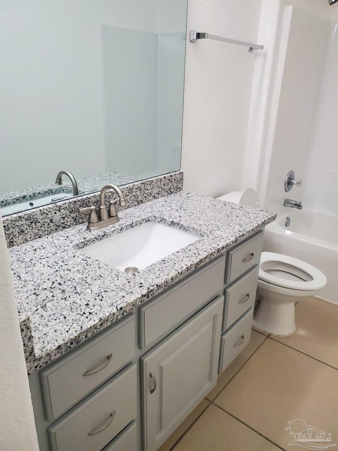659 Griswold Road Jay, FL 32565 - Photo 12 of 42 a bathroom with a granite countertop sink and a mirror