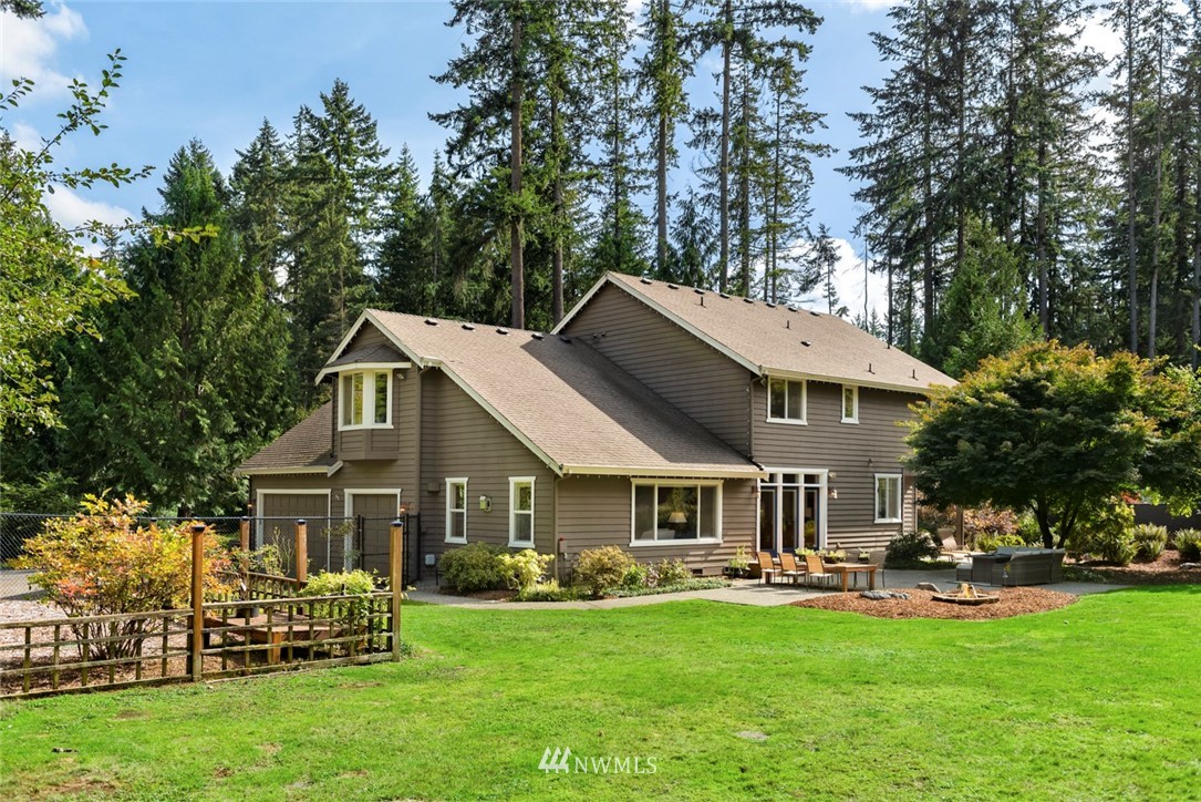 22326 53rd Avenue Southeast Bothell, WA 98021 - Photo 22 of 25 a front view of a house with swimming pool table and chairs