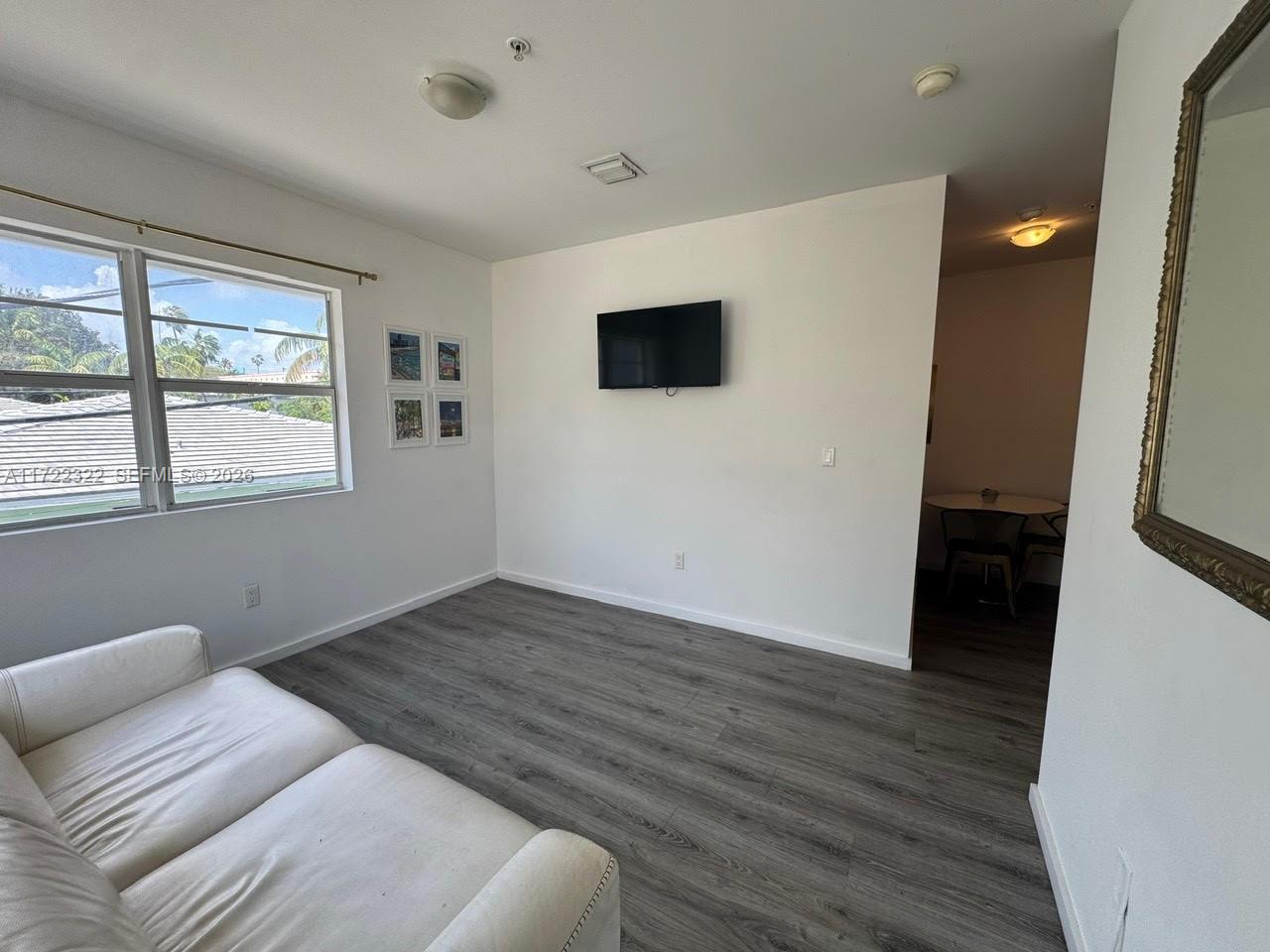 810 7th Street, Unit 207 Miami Beach, FL 33139 - Photo 6 of 16 a bedroom with a bed and a window