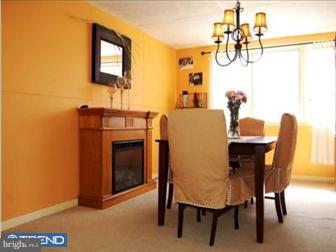 337 Sycamore Road West Reading, PA 19611 - Photo 3 of 6 a view of a dining room with furniture and a fireplace