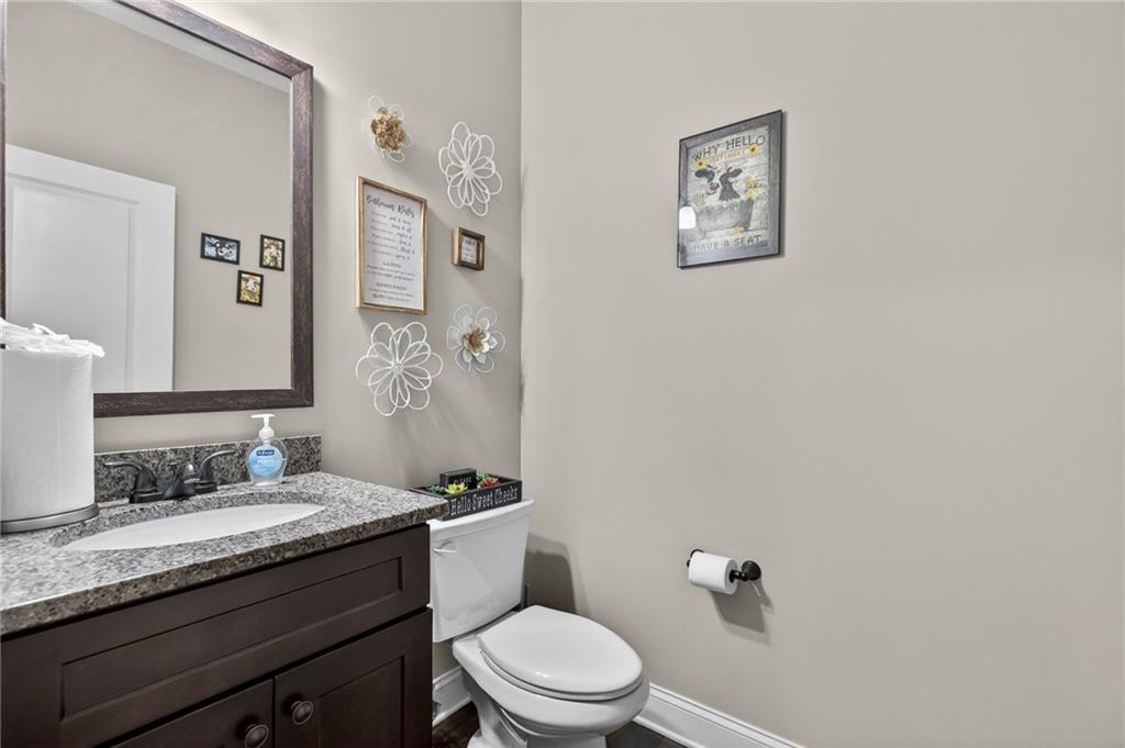 22 Turtle Rock Place Acworth, GA 30101 - Photo 11 of 70 a bathroom with a granite countertop toilet sink and mirror