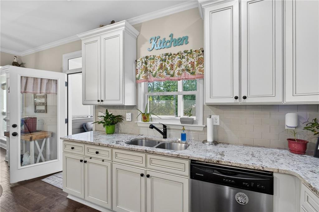 22 Turtle Rock Place Acworth, GA 30101 - Photo 20 of 70 a kitchen with stainless steel appliances granite countertop white cabinets and window