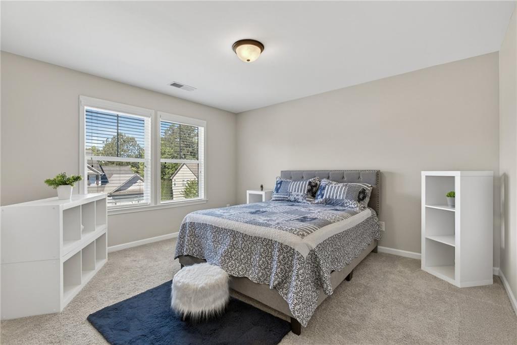 22 Turtle Rock Place Acworth, GA 30101 - Photo 36 of 70 a spacious bedroom with a bed and a window