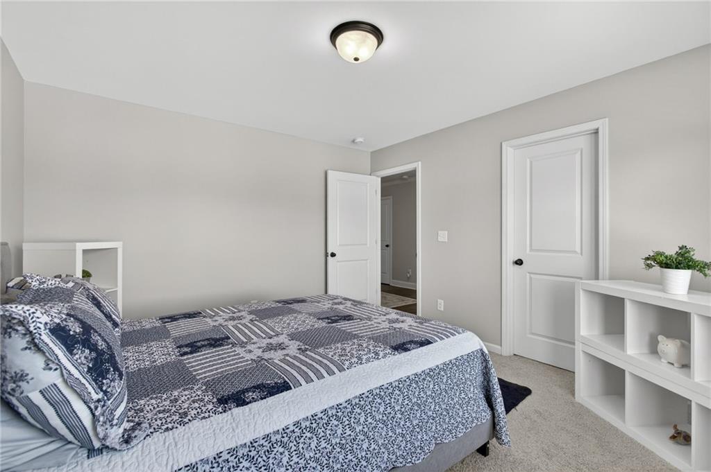 22 Turtle Rock Place Acworth, GA 30101 - Photo 37 of 70 a bedroom with a bed and a window