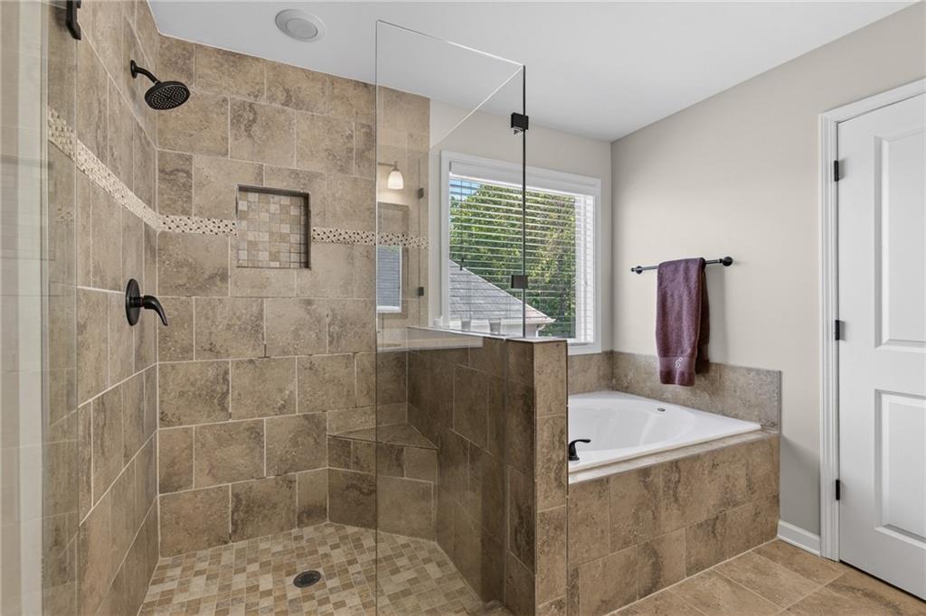 22 Turtle Rock Place Acworth, GA 30101 - Photo 46 of 70 a bathroom with a tub sink and window