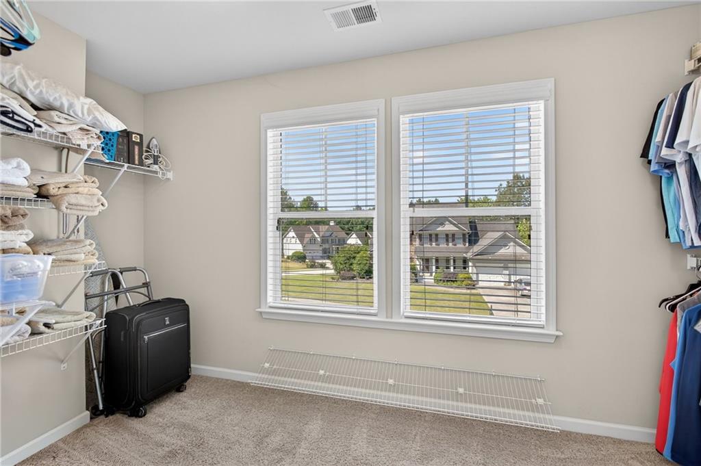 22 Turtle Rock Place Acworth, GA 30101 - Photo 47 of 70 a view of a room with gym equipment and a window