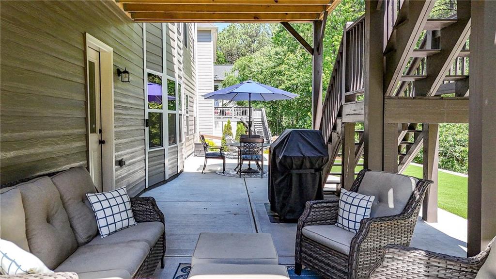22 Turtle Rock Place Acworth, GA 30101 - Photo 54 of 70 a outdoor living space with furniture and a garden