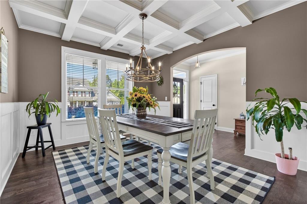 22 Turtle Rock Place Acworth, GA 30101 - Photo 10 of 70 a dining room with chandelier fan and wooden floor
