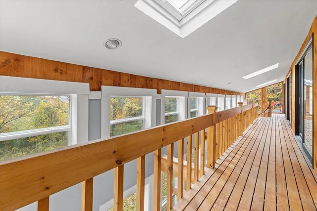 a view of balcony with wooden floor