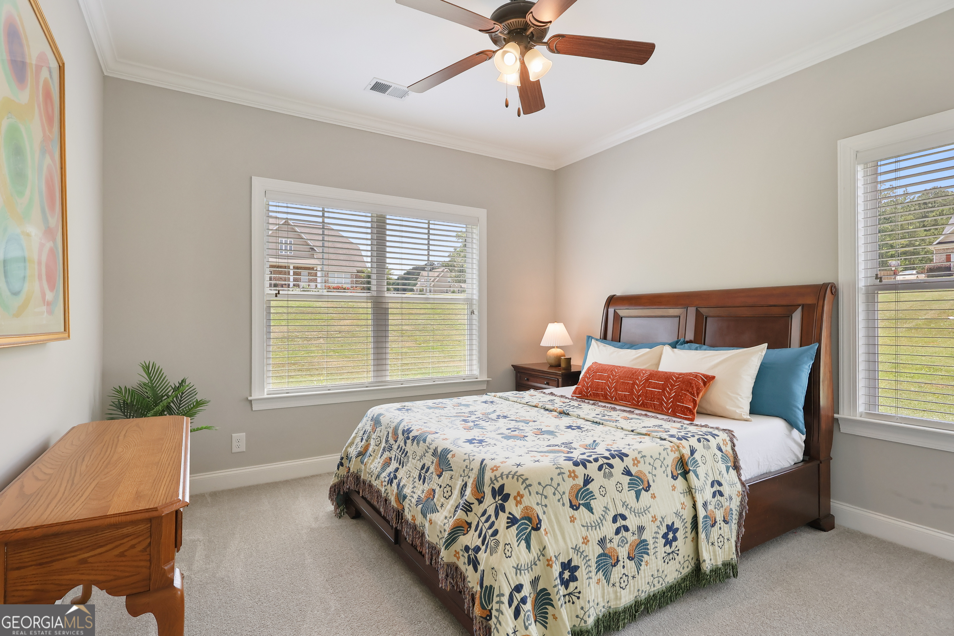 89 Claire Road Forsyth, GA 31029 - Photo 5 of 40 a bedroom with a bed and window