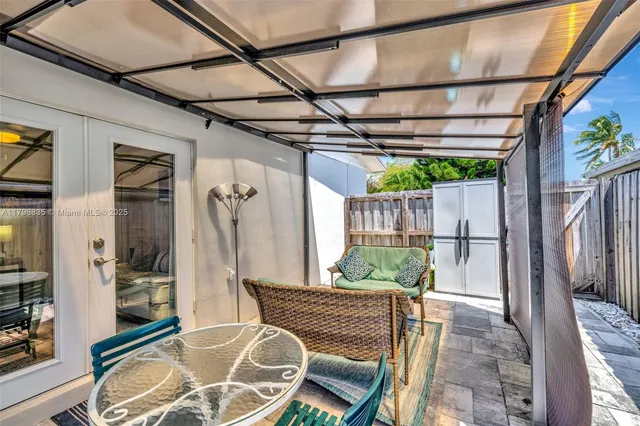 a backyard of a house with seating space