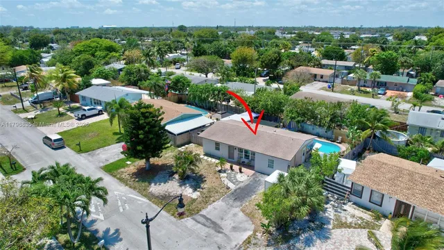 an aerial view of a house with a garden