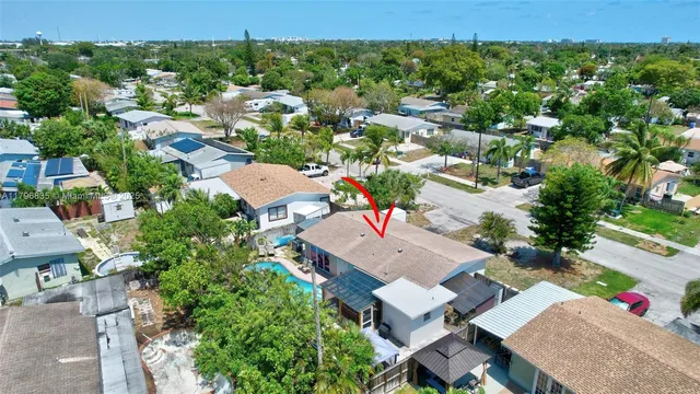 an aerial view of residential houses with outdoor space