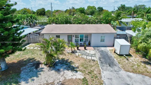 a view of a house with a yard and plants