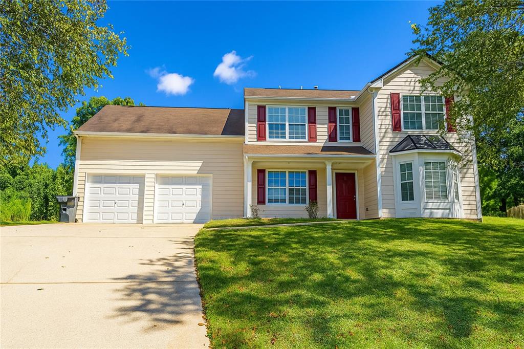 a house view with a garden space