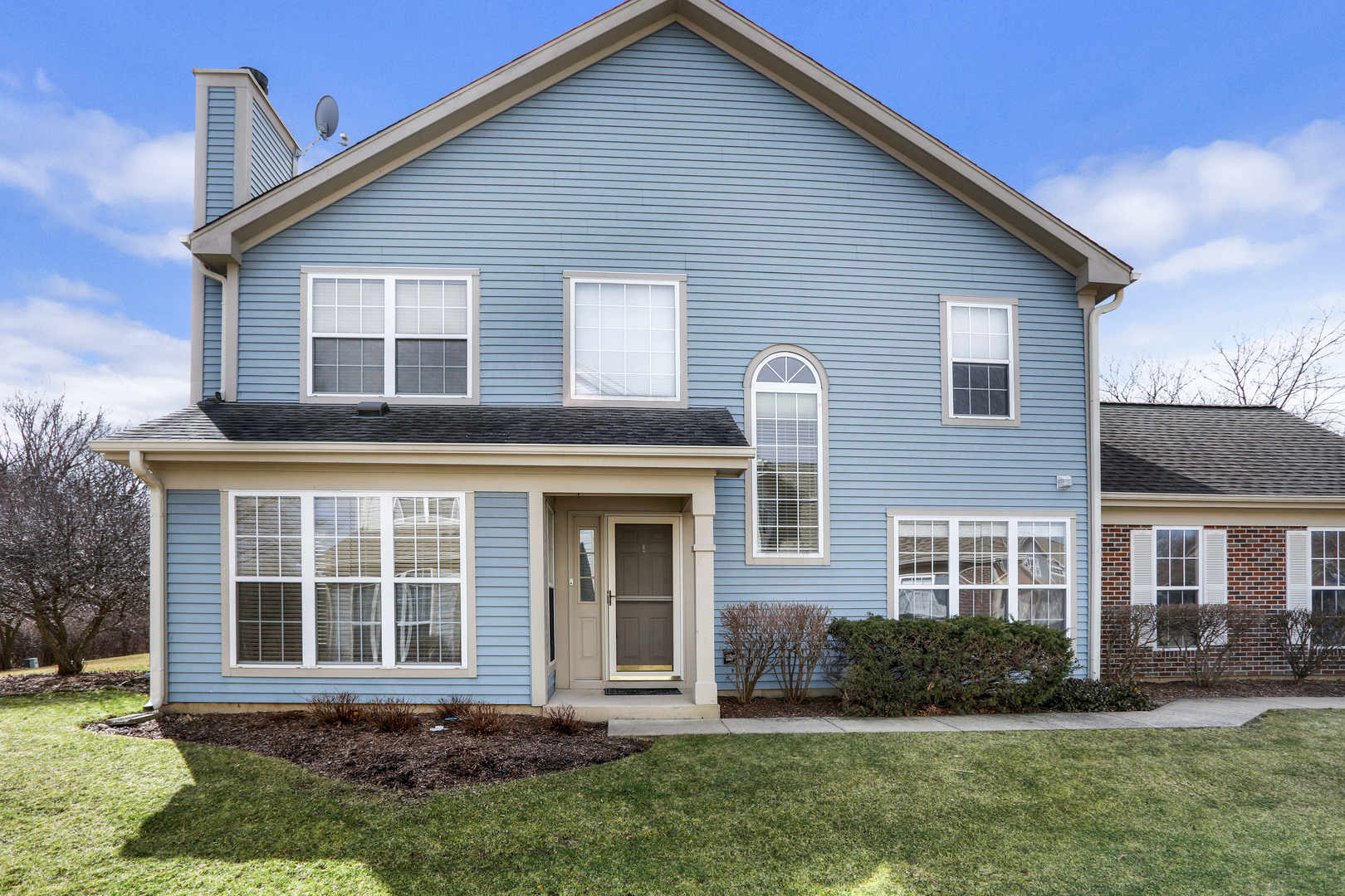 1240 Coldspring Road Elgin, IL 60120 - Photo 1 of 17 a front view of a house with a yard