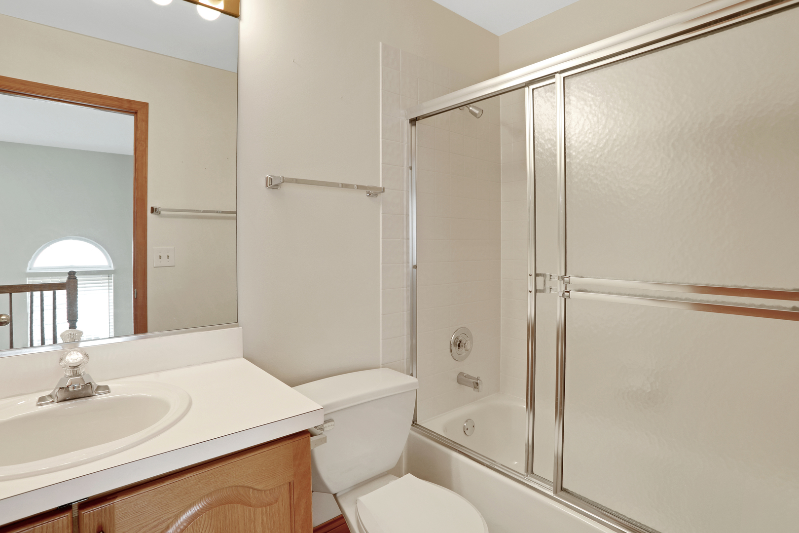 1240 Coldspring Road Elgin, IL 60120 - Photo 14 of 17 a bathroom with a sink toilet and shower