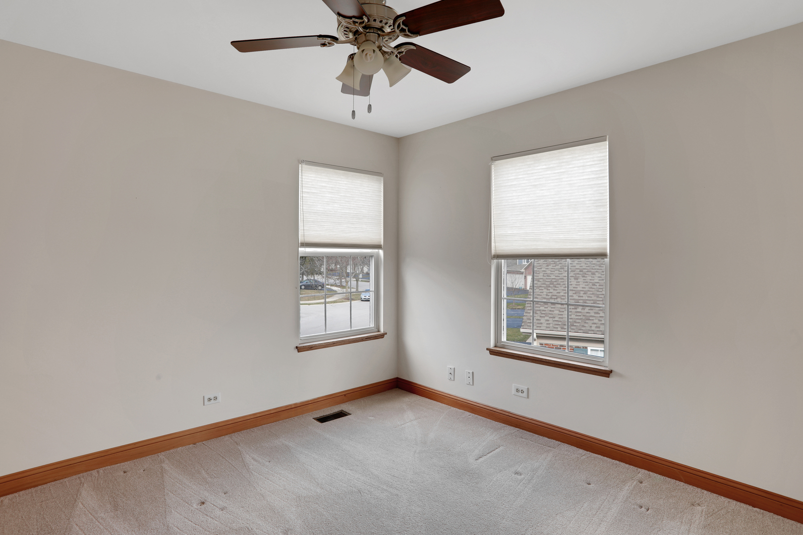 1240 Coldspring Road Elgin, IL 60120 - Photo 15 of 17 an empty room with windows and fan