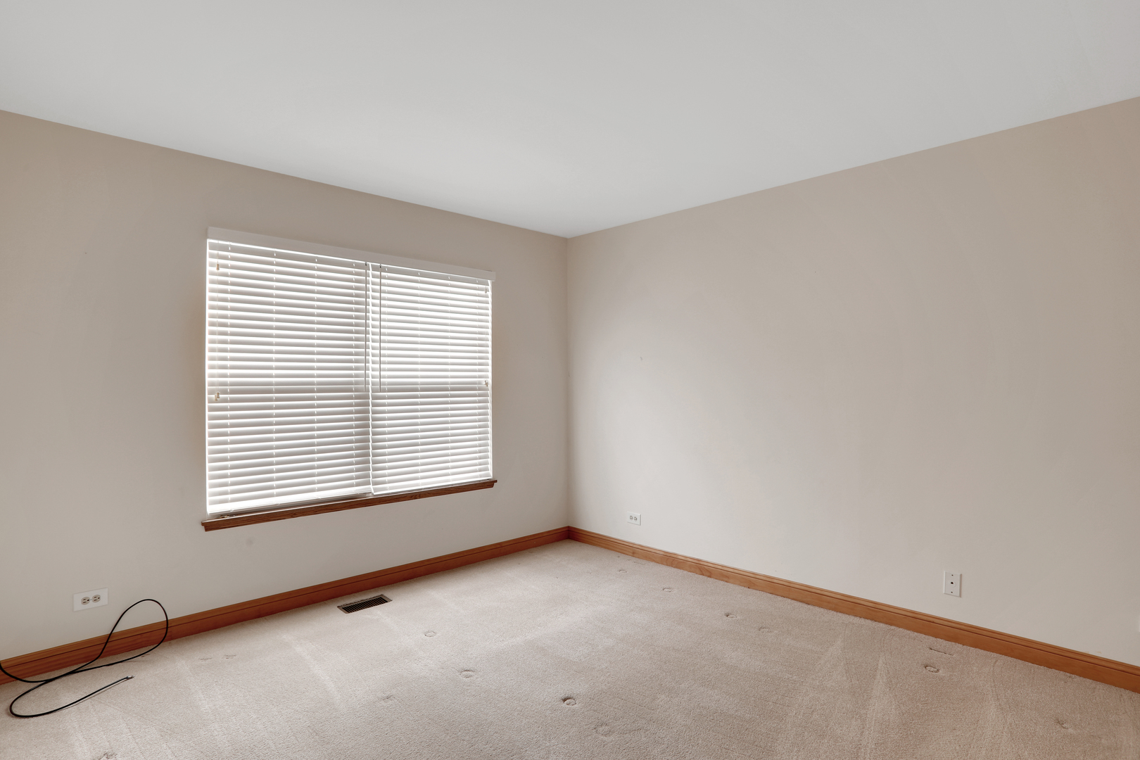 1240 Coldspring Road Elgin, IL 60120 - Photo 16 of 17 an empty room with a window