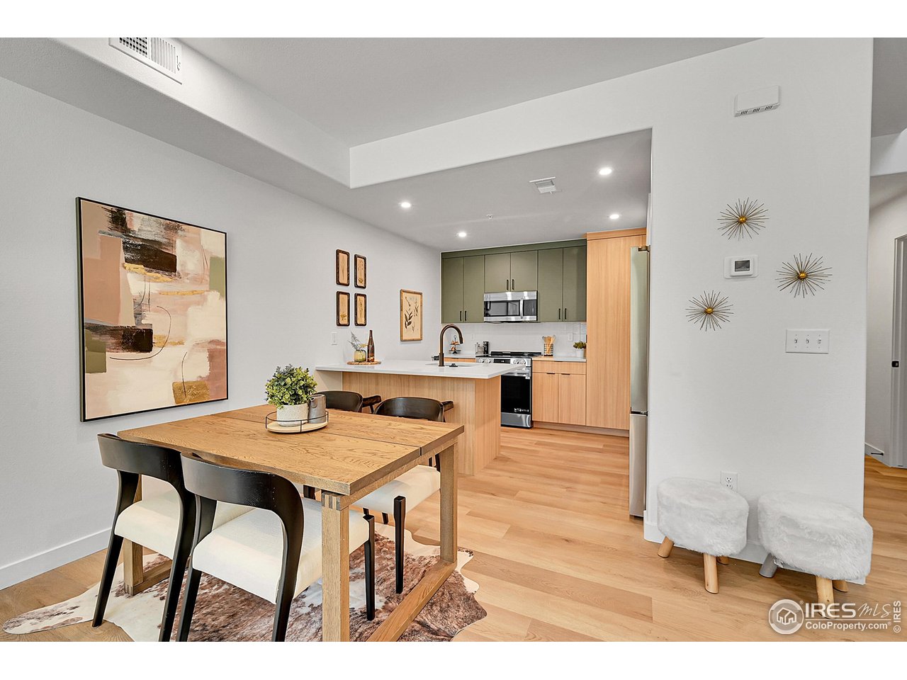 777 East County Line Road Erie, CO 80516 - Photo 3 of 15 a open kitchen with a table and chairs in it