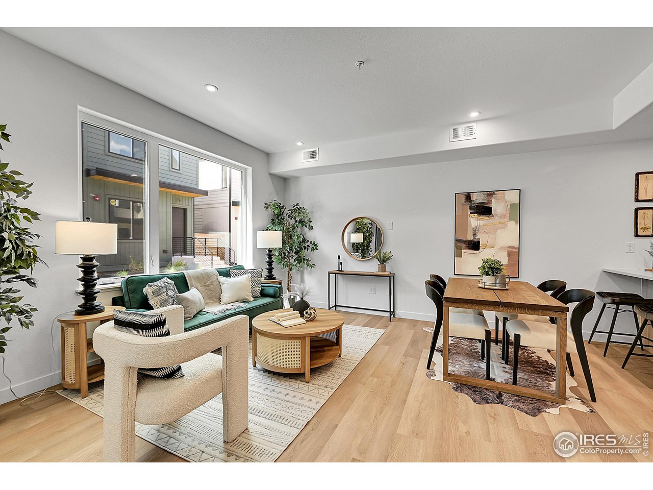 777 East County Line Road Erie, CO 80516 - Photo 5 of 15 a living room with furniture a rug and a large window