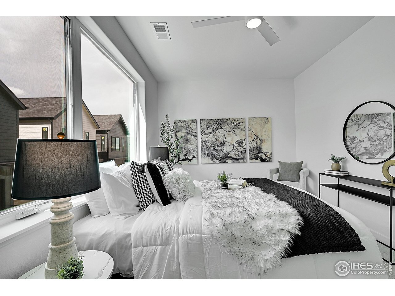 777 East County Line Road Erie, CO 80516 - Photo 8 of 15 a bedroom with a large bed and a window