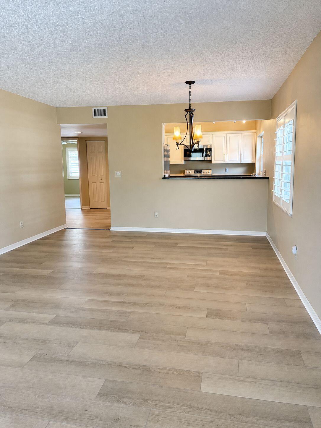 1871 Southwest Palm City Road, Unit G401 Stuart, FL 34994 - Photo 3 of 16 a view of a kitchen with a sink and dishwasher