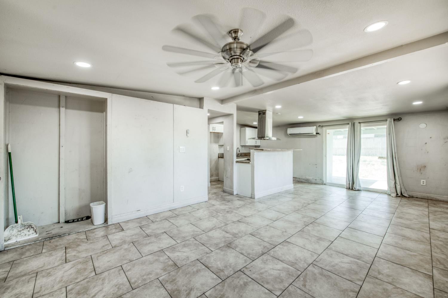 2326 East Hampton Way Fresno, CA 93726 - Photo 3 of 22 a view of a kitchen with a sink and a refrigerator