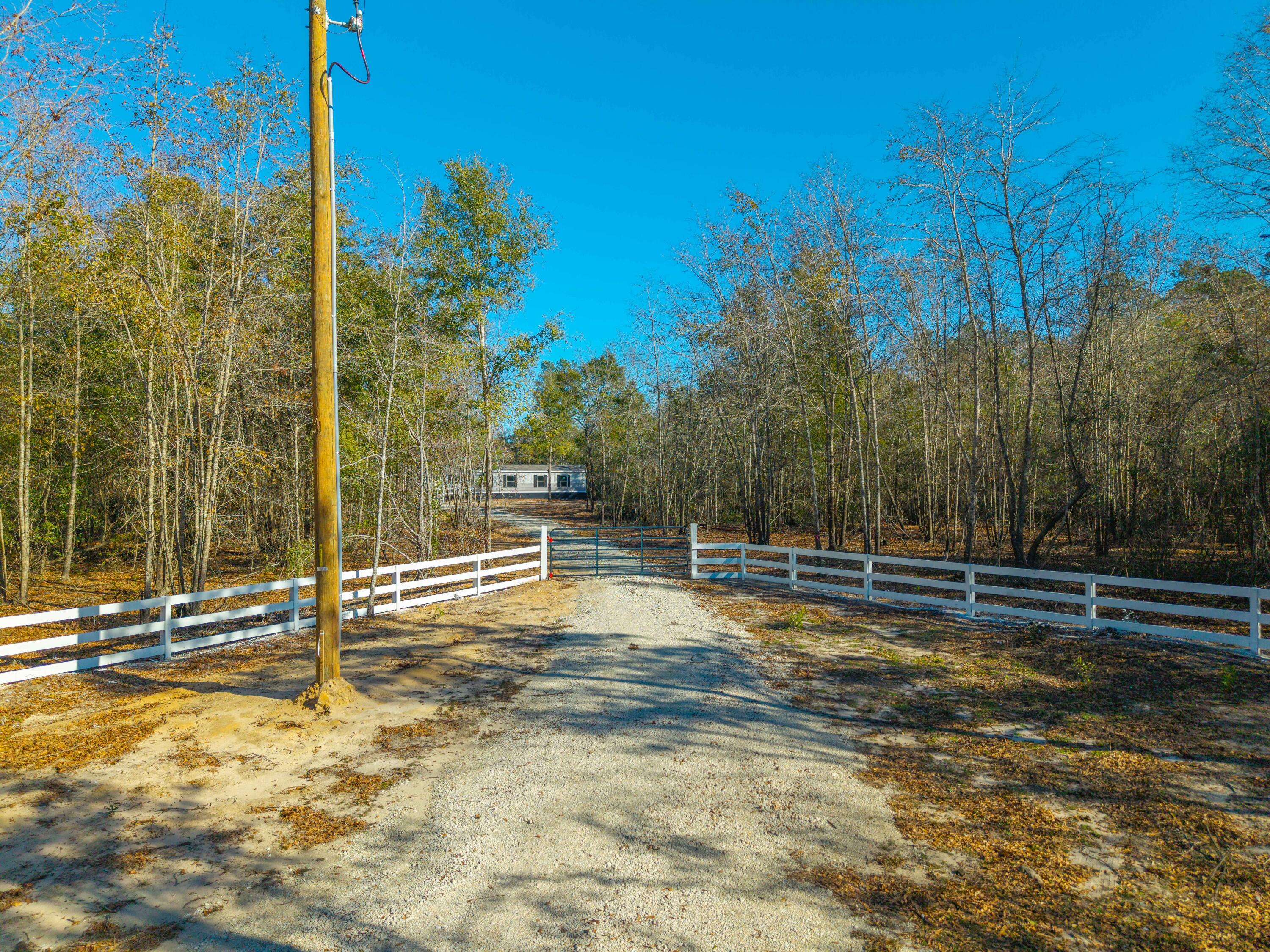 818 Pigeon Bay Road Cross, SC 29436 - Photo 2 of 42 DJI_20250116144156_0164_D