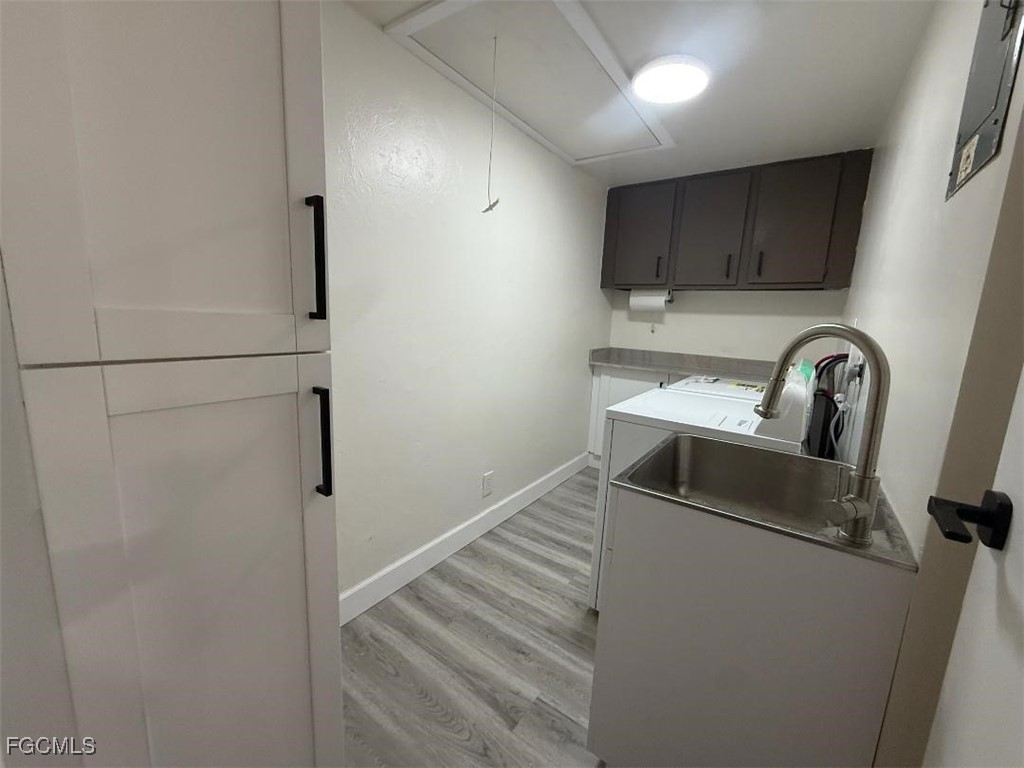 5219 Treetops Drive, Unit I Naples, FL 34113 - Photo 7 of 9 a kitchen with a refrigerator and a sink