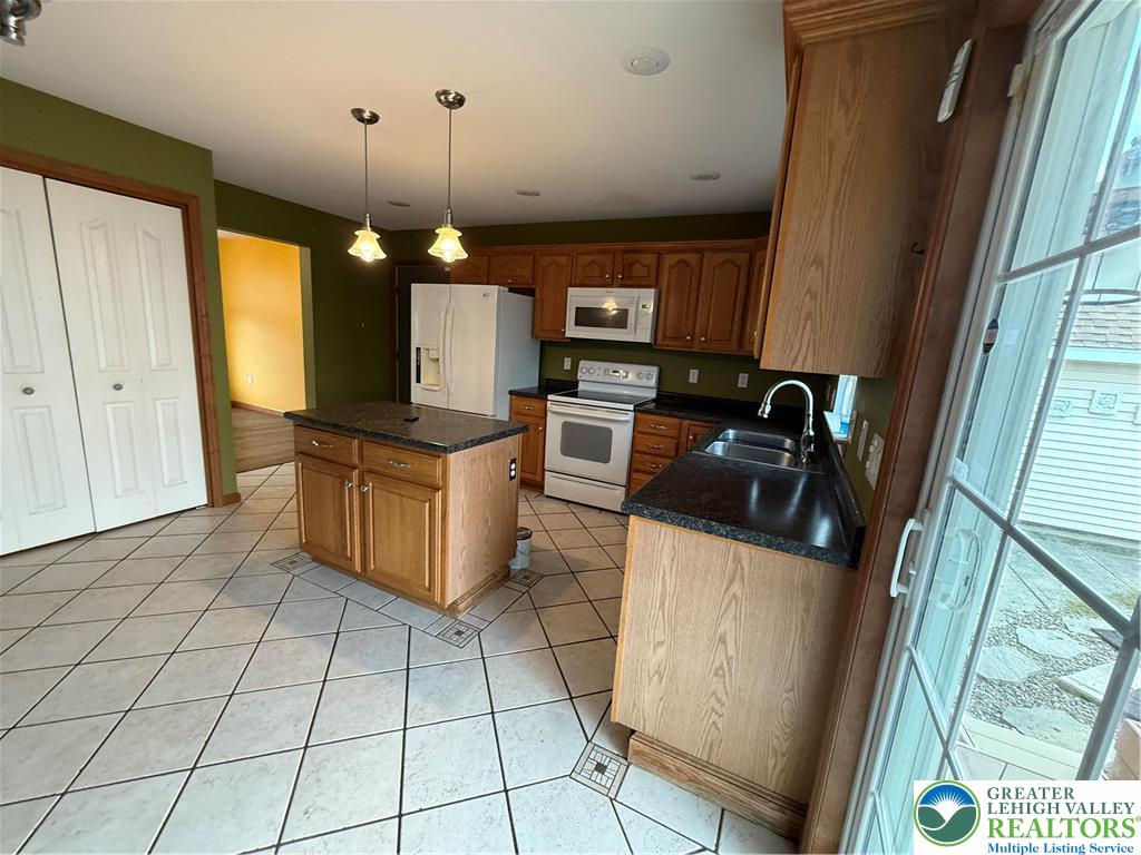 114 Kestrel Road Mountain Top, PA 18707 - Photo 10 of 37 a kitchen with a sink a counter space cabinets and appliances