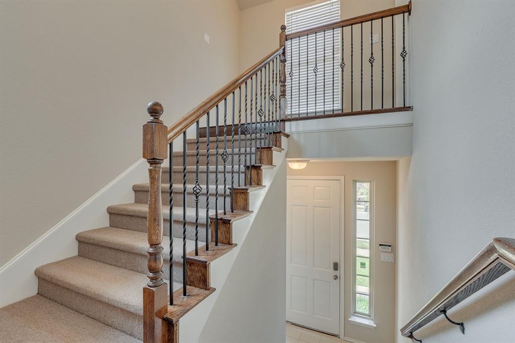 2705 McCart Avenue, Unit 205 Fort Worth, TX 76110 - Photo 2 of 25 a view of entryway with wooden floor