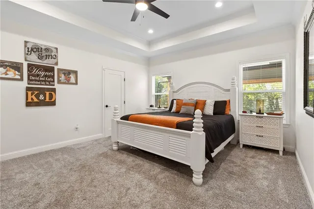 a bedroom with bed and a window