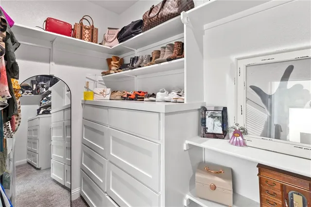 a bathroom with a sink a mirror and a shower