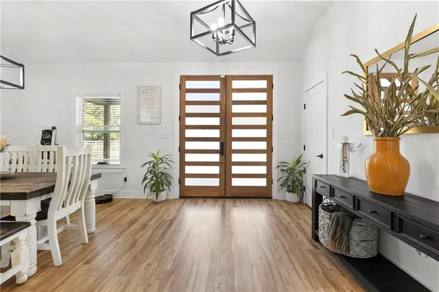 a view of a room with furniture and wooden floor