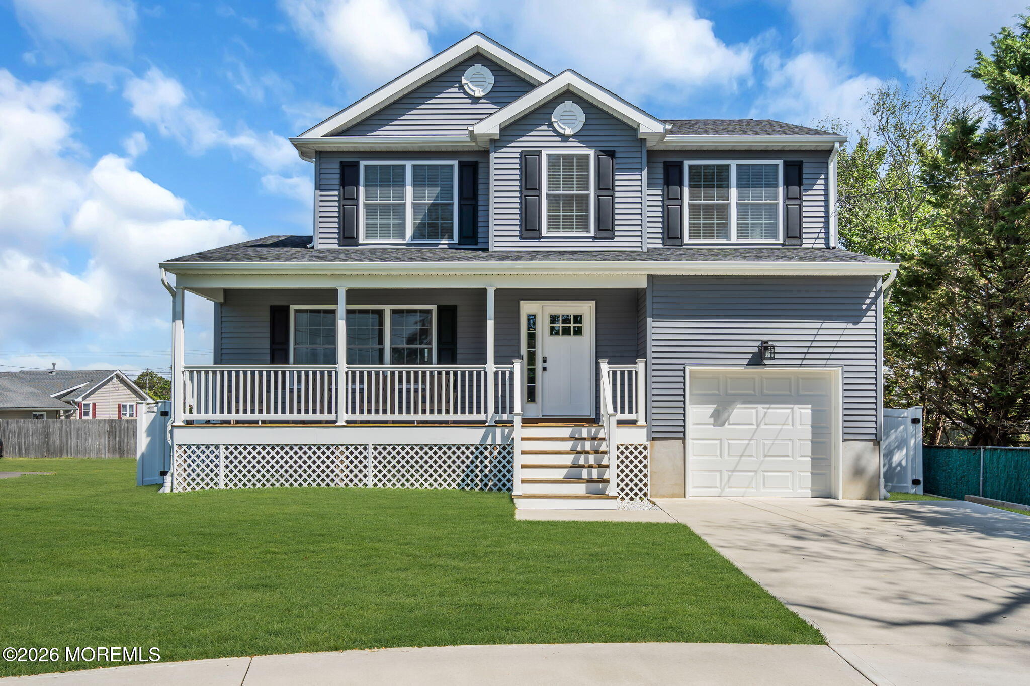 312 Beach Boulevard Forked River, NJ 08731 - Photo 2 of 40 a front view of a house with a yard