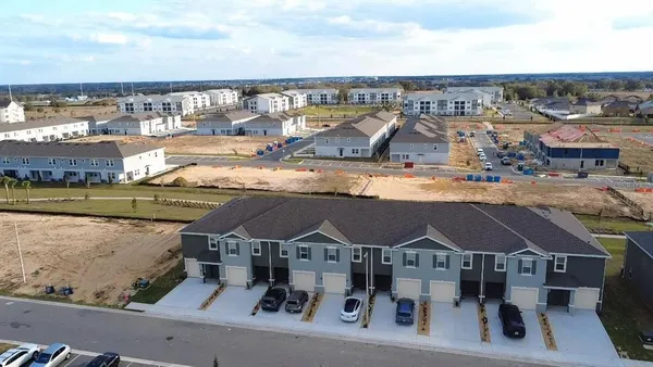 a view of swimming pool with outdoor seating