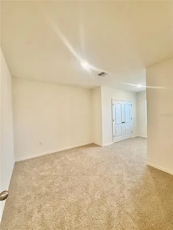 an empty room with a natural light