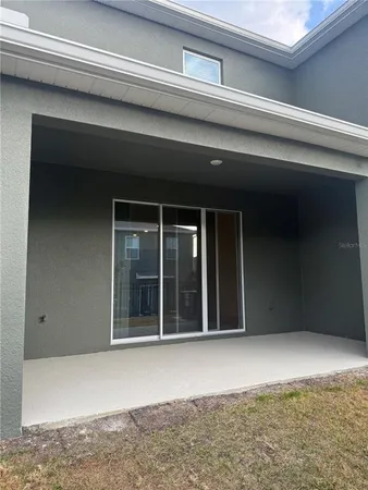 a large kitchen with kitchen island wooden cabinets and stainless steel appliances