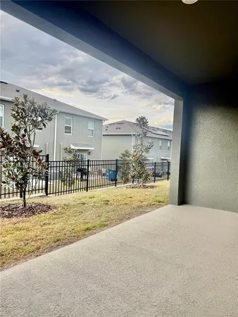 a kitchen with kitchen island granite countertop a stove and a refrigerator