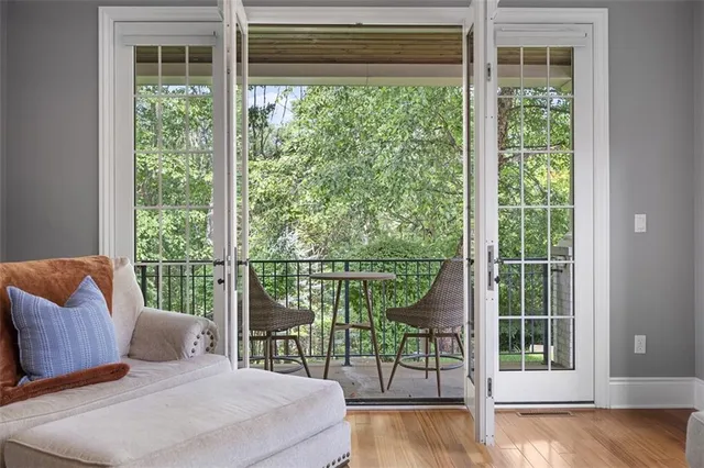 a bedroom with a bed and a wooden floor