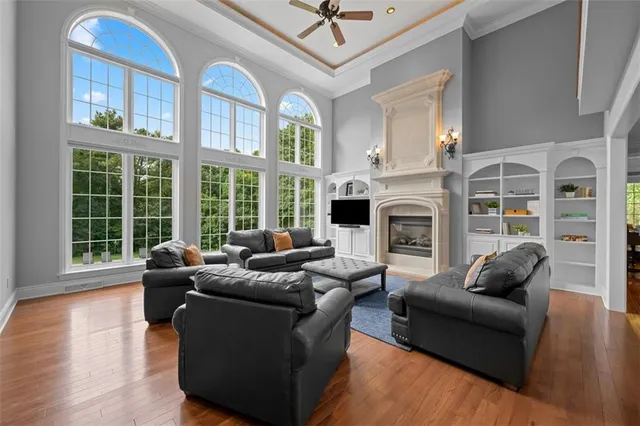 a living room with furniture fireplace and flat screen tv