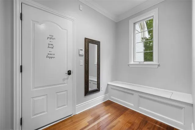 a view of room with window and hardwood floor