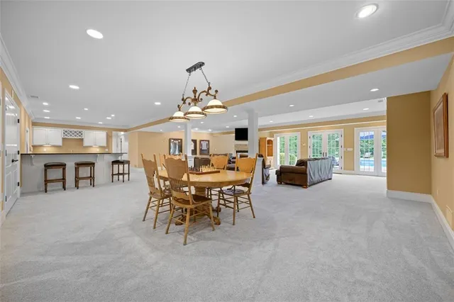 a view of a dining room with furniture window and outside view