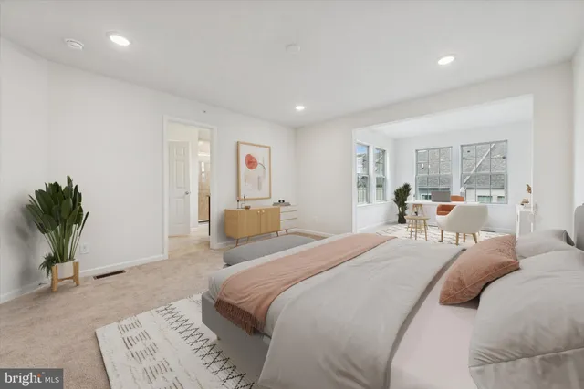 a white toilet sitting next to a white cabinet