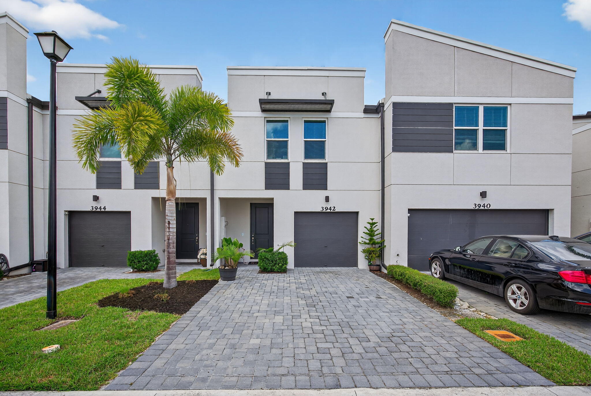 3942 Southeast Caladium Court Stuart, FL 34997 - Photo 1 of 38 a house view with a garden space